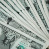 Closeup of novelty one million dollar bills laid out in a fan arrangement.
