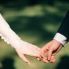 man and woman holding hands focus photo