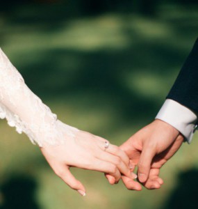 man and woman holding hands focus photo