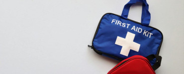Two first aid kits on a white background with ample copy space.