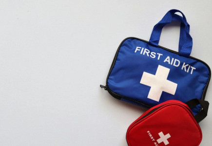 Two first aid kits on a white background with ample copy space.