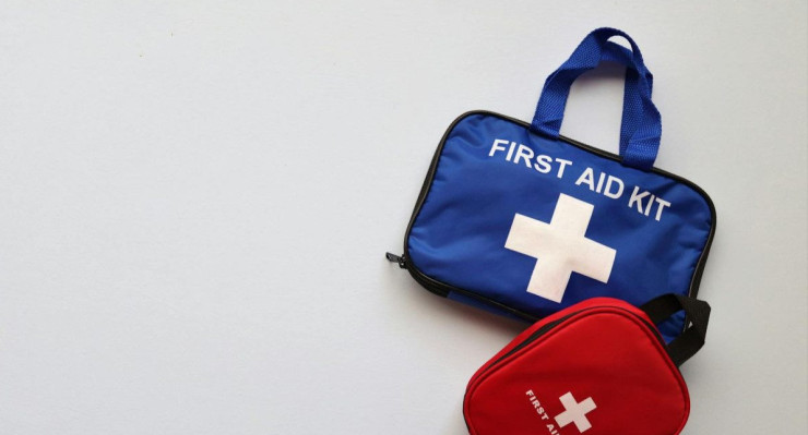 Two first aid kits on a white background with ample copy space.