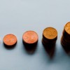 eight round gold coins on white surface