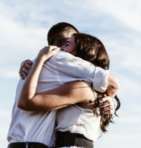 man and woman hugging each other photography