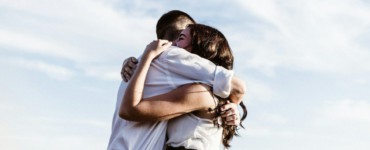 man and woman hugging each other photography