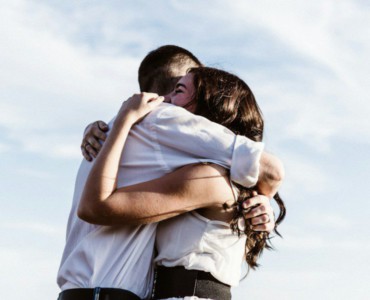 man and woman hugging each other photography