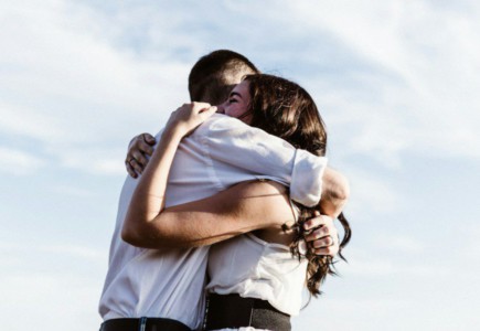man and woman hugging each other photography