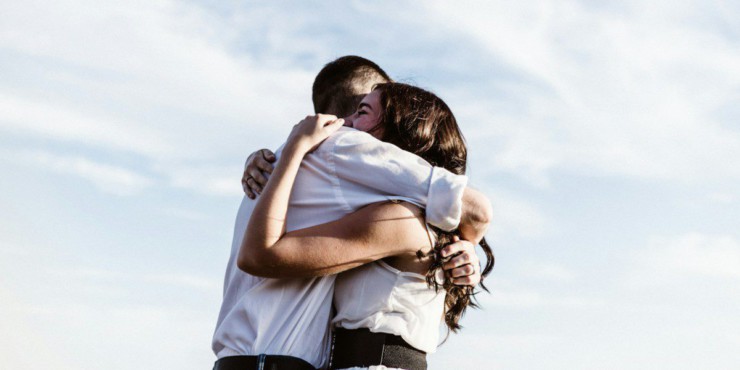 man and woman hugging each other photography