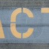 blue and white love print on gray concrete wall