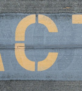 blue and white love print on gray concrete wall
