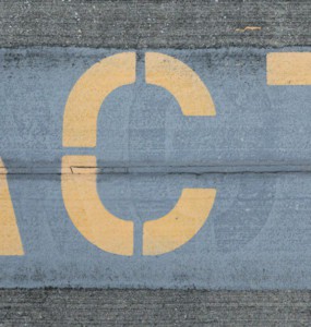 blue and white love print on gray concrete wall