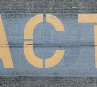 blue and white love print on gray concrete wall