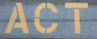 blue and white love print on gray concrete wall