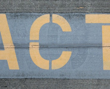 blue and white love print on gray concrete wall