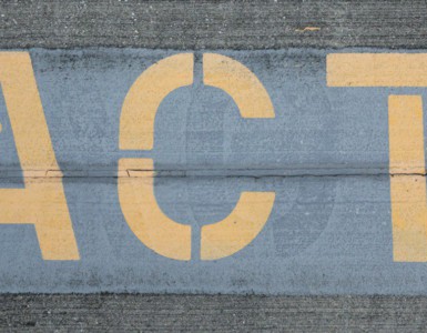 blue and white love print on gray concrete wall