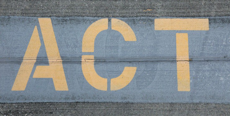 blue and white love print on gray concrete wall
