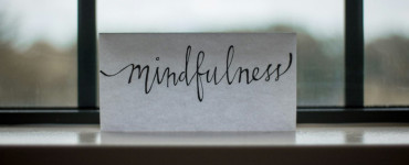 mindfulness printed paper near window
