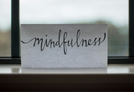 mindfulness printed paper near window