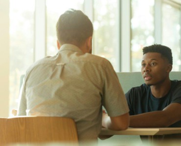 two men talking