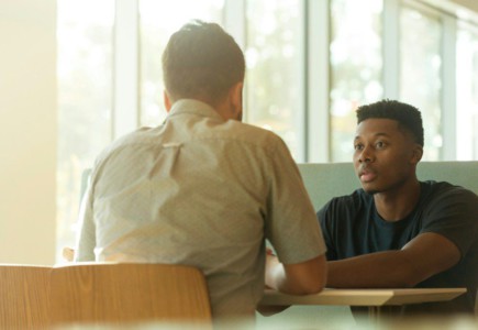 two men talking