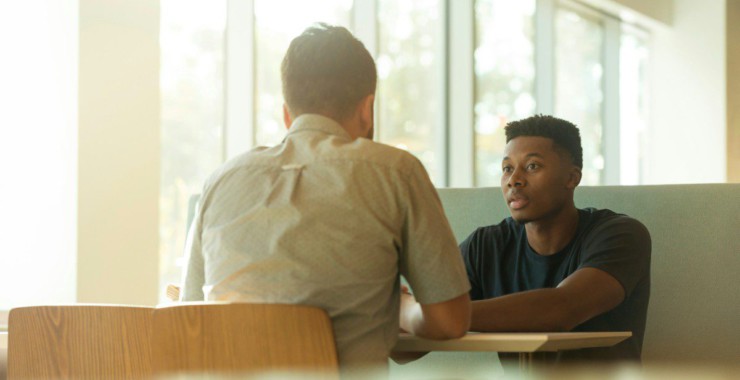 two men talking